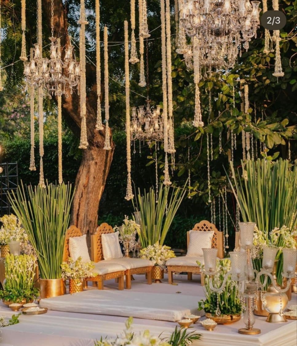 Garden mandap with chandeliers and florals